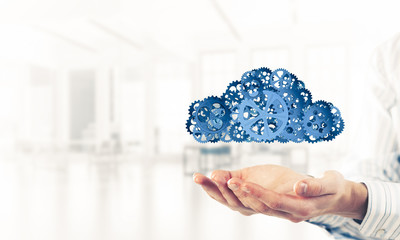 Man presenting in his palms cloud computing concept as mechanism
