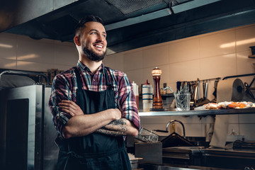 Portrait of stylish cook on a kitchen.