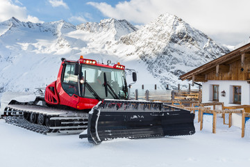 Snow Groomer Outside a Mountain Restaurant