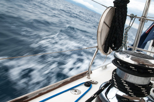 Close Up Of Water Rushing Past A Sailing Yacht