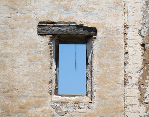 Old ruined facade with window