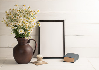 Daisy bouquet in clay jug with  motivational frame in scandinavian style