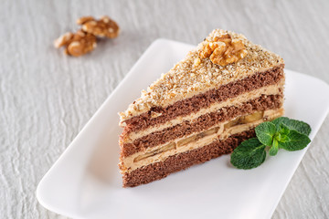 walnut cake with nut cream and banana, gluten free pie, product photography for patisserie