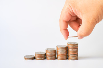 Money, Financial, Business Growth concept, stack of coins with Man's hand put money coins on white background with copyspace , Finance banking account and money currency saving background 