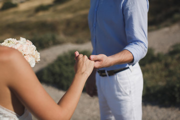 Bride and groom walking together holding their hands