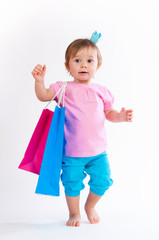Sweet girl in pink and blue design with paper bags isolated on white background.
