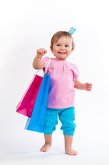 Sweet girl in pink and blue design with paper bags isolated on white background.