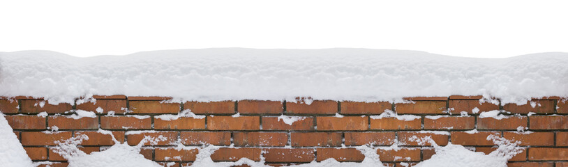 Snow covered red brick wall isolated on white