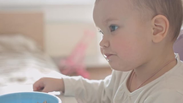 Close up of small child eat vegetables for lunch