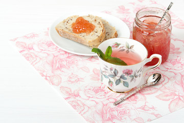 Watermelon Jam, Herbal Tea, Marshmallows. White Wooden Table