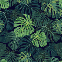 Naklejka na ściany i meble Seamless vector tropical pattern with green monstera palm leaves on dark background. Exotic hawaiian fabric design.