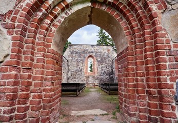 Doorway of an old roofless church ruins on a beautiful sunny mid-summer day in Finland.
