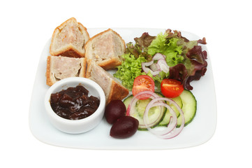 Pork pie pickle and salad on a plate