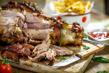 Roasted pork knuckle with french fries