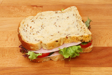 Ham salad sandwich on a chopping board