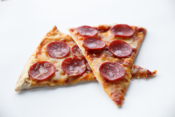 Pepperoni pizza. Hot homemade food. Slices of fresh italian classic salami pizza. Popular topping with cheese. Baked meal.