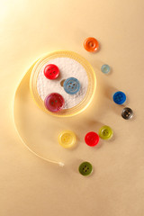 Colourful buttons and ribbon roll