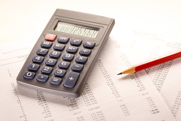 Operating budget, calculator and pencil