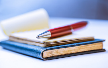 Notebooks with red pen