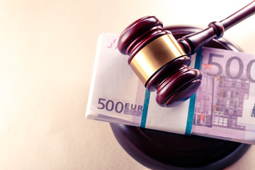 Wooden judge's gavel and euro