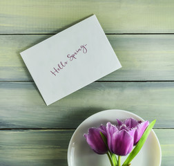 Spring tulips on a white plate.