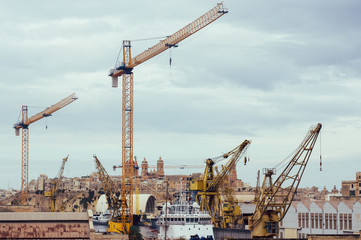 Fototapeta na wymiar Cranes in the port, Malta, Three cities