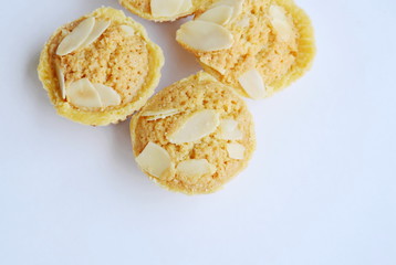 butter cookies cup topping slice almond on white background