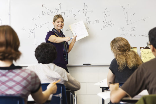 Woman teaching geometry class
