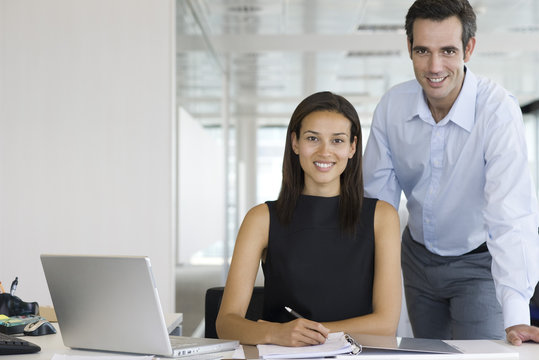 Businesswoman and businessman, portrait