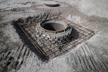 Manhole cover and road construction