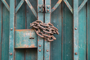 Locked lock metal door with a chain
