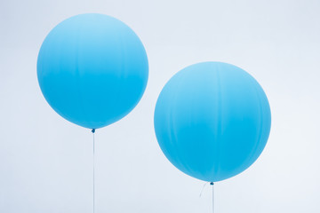Two blue inflated balloons