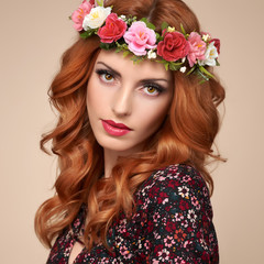 Fototapeta premium Fashion Beautiful Curly Redhead Portrait in Flower Wreath. Shiny Curly flower fashion Volume Hairstyle. Happy Beauty Model Woman. Glamour Confident Sexy lady, fashion Makeup, Boho wreath, Trendy Dress