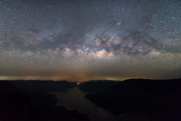 Clearly Milky way above the lake and mountain. Pha Dang Luang view point, Mae Ping National park.