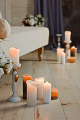 Romantic interior for Valentine's day with candles lights burning in room.