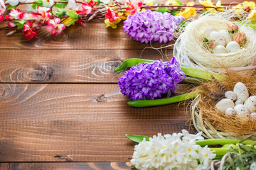 Beautiful Easter eggs with flowers hyacinths on the wooden background