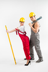 Male and female builders posing