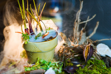 Molecular modern cuisine dish in a pot covered with nitrogen smoke