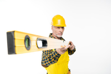 Workman with level tool