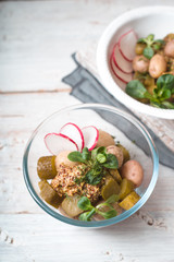Vegetable salad  on the white wooden table  vertical
