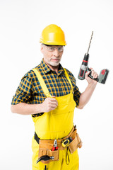 Workman holding electric drill