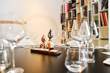 Restaurant served table with a bookshelf on background