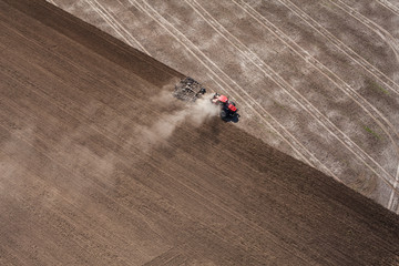 aerial view of the tractor working on the harvest field