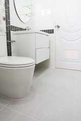 Fototapeta na wymiar Modern design home bathroom toilet and sink White colur sanitary ware in the bathroom