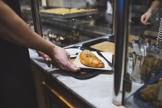 Waiter Serving Pastery