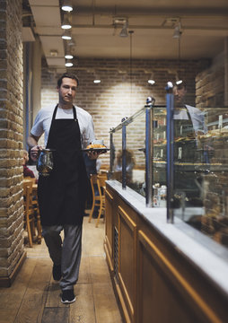 Waiter Working at Coffee Shop