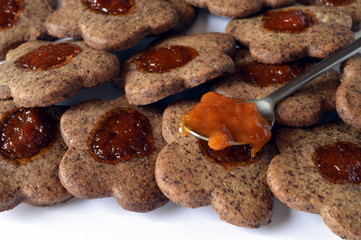 Homemade delicate butter cookies with grated chocolate and apricot jam
