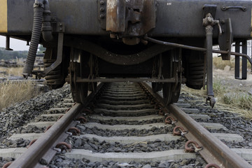 Fototapeta na wymiar Industrial rail car wheels closeup photo ,train wheel