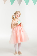 Girl with heart shaped cookie