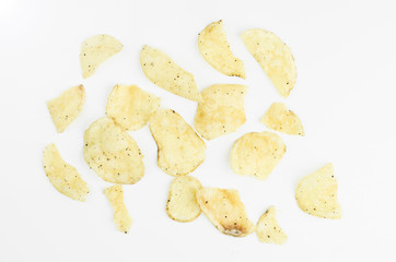 Handmade Potato Chips With Salt And Black Paper On White Background